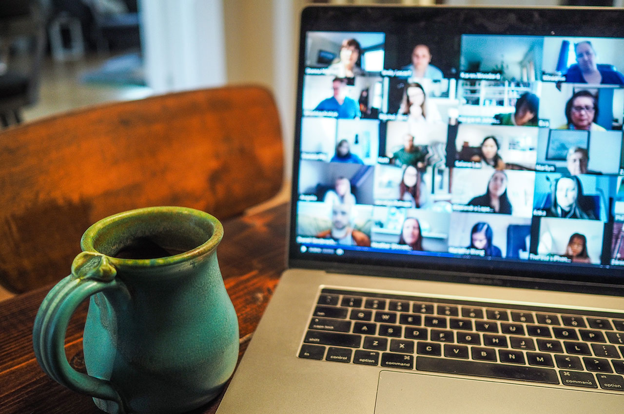 Photo of a video call on a laptop with a mug next to it - Photo by Chris Montgomery on Unsplash