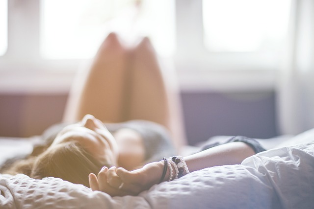 Woman lying on her back on a bed, slightly blurred - Image by Ichigo121212 from Pixabay