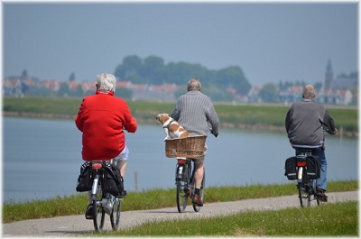 Older people riding bicycles